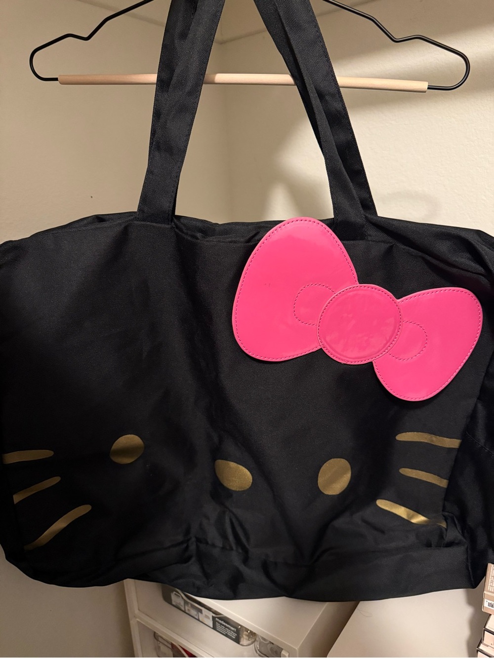 Black Tote Bag with Pink Bow and Gold Accent Face
